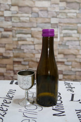 A glass and a bottle of wine. Passover holiday, Jewish holiday.