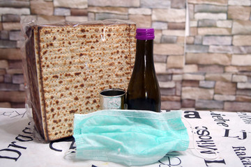 Corona Passover. Dust mask, bottle of wine and matzah - a traditional Jewish food for Passover
