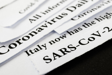 Coronavirus breaking news headline clippings from various newspapers reporting on the deadly disease.