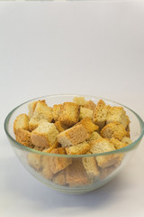 breadcrumbs in a glass bowl on a white background 