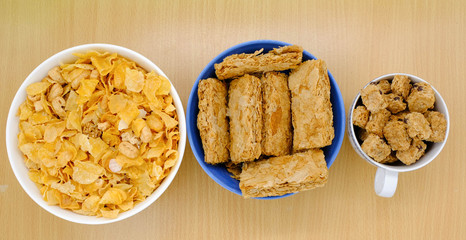 cereal in a white bowl on wooden background. Healthy breakfast concept.