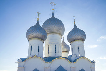 Domes of the Assumption Cathedral close-up on a sunny summer day. Rostov Great, Golden Ring of Russia