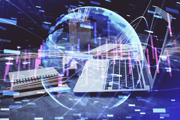 Financial graph colorful drawing and table with computer on background. Multi exposure. Concept of international markets.