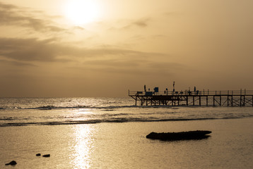Red Sea near Marsa Alam, Egypt, Africa. Silhouette of the pier above the coral reef at dawn, used for diving or snorkeling