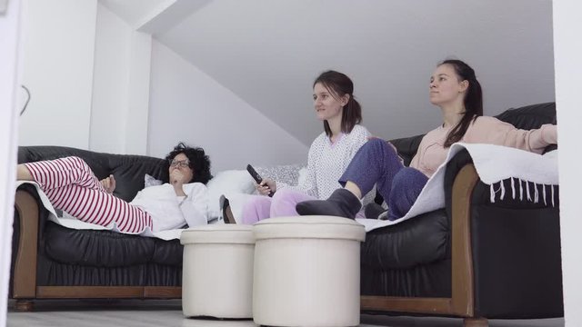Young family football supporters cheering team watching online sport game