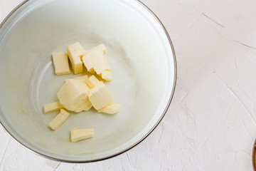 chopped butter in the pan to make a cake