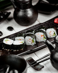 black sushi with rice on the table