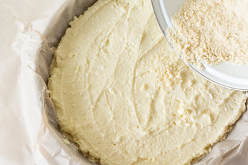 sprinkle the remaining raw shortbread dough on top of the cottage cheese