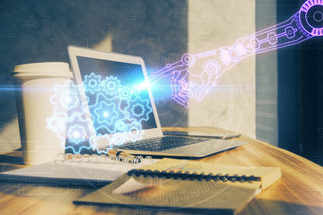 Double exposure of desktop computer and technology theme hologram. Concept of software development.