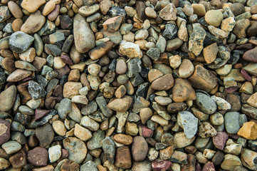 many colored stones. building material. beach pebbles