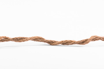 Old brown roped against a white background
