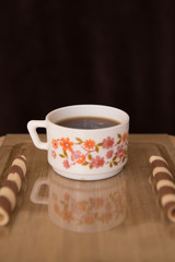 cup of coffee with sweets