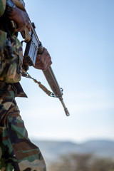 soldier in camouflage with a rifle
