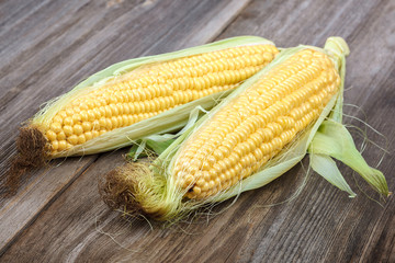 Corn on the background of the wooden planks