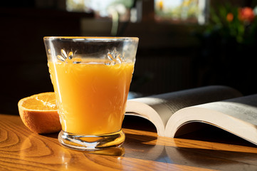 orange juice on the wooden table for breakfast 