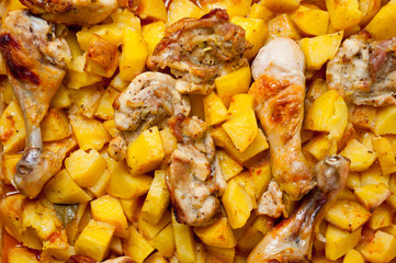 Baked potato with chicken cooked in an electric oven. Background for cooking.