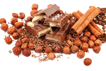 Chocolate tiles and nuts on white background