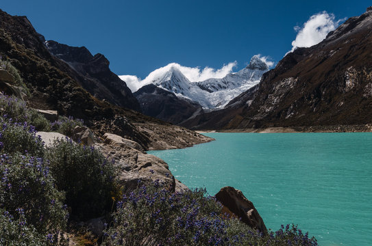 .turquoise lagoon of paron with high snow-capped mountain peaks in the background in horizontal