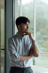 A young Asian business man is working