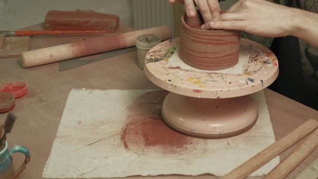 Ceramist work in the workshop.