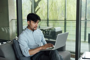 Fototapeta premium A young Asian business man is working