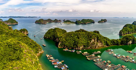Floating fishing village and rock island in " Lan Ha " Bay, Vietnam, Southeast Asia. UNESCO World Heritage Site. Landscape. Popular landmark, famous destination of Vietnam. Near " Ha Long " bay © Hien Phung