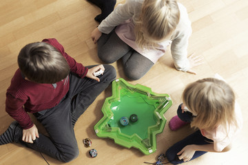 Kids playing game together at home