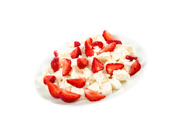 Cottage cheese and strawberries isolated on a white background