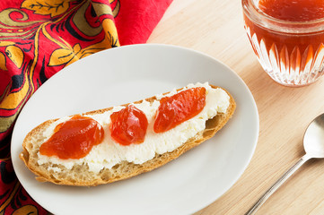 open sandwich with butter and yellow plums jam 