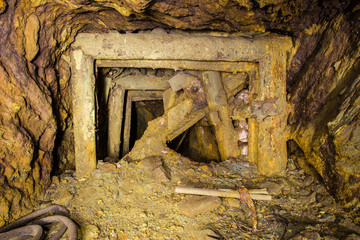 Old underground copper mine shaft tunnel with orechute