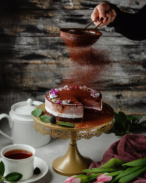 chocolade cake with cacao powder on the table