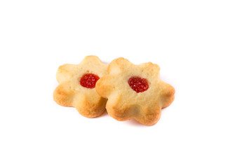 Yellow home made cookies with jam on white