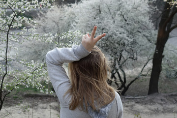 girl playing in a flowered garden