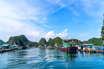 Floating fishing village and rock island in " Lan Ha " Bay, Vietnam, Southeast Asia. UNESCO World Heritage Site. Landscape. Popular landmark, famous destination of Vietnam. Near " Ha Long " bay © Hien Phung