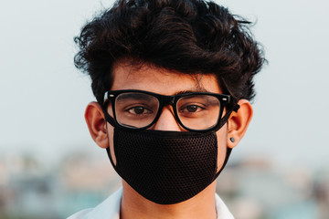 Portrait of an Indian male doctor wearing mask to prevent himself from the corona virus pandemic