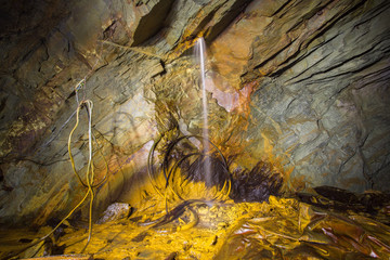 Water waterfall in copper underground mine