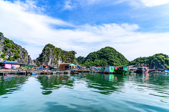 Floating fishing village and rock island in " Lan Ha " Bay, Vietnam, Southeast Asia. UNESCO World Heritage Site. Landscape. Popular landmark, famous destination of Vietnam. Near " Ha Long " bay