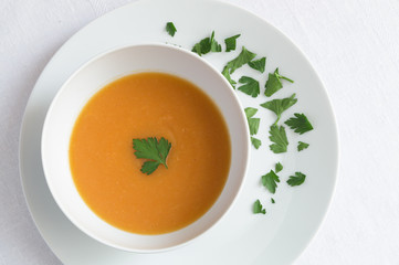pumpkin soup puree decorated with parsley