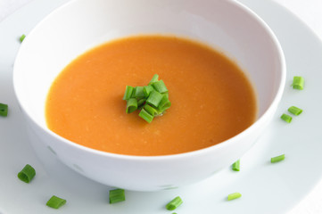 pumpkin soup puree decorated with green onion