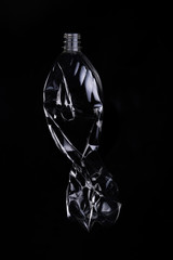 empty plastic bottle for recycling over dark background