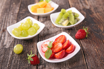strawberry, grapes, kiwi and melon