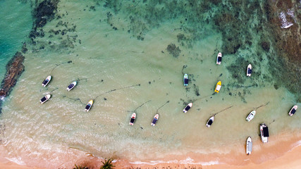 Speed boats in the blue lagoon near the tropical beach