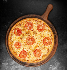 crispy pizza with cheese and tomatoes