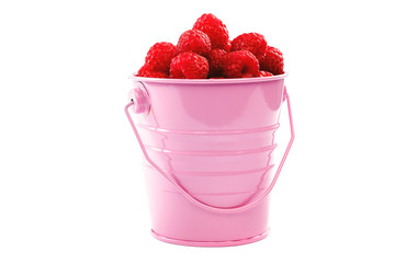 Fresh raspberries in a bucket on a white background