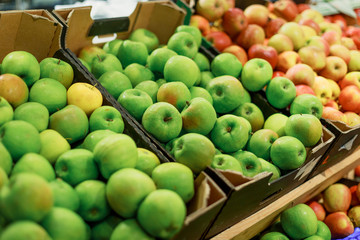 apples on the counter in the store