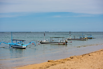 Fishing boats anchored in the bay. Sanur, Bali, Indonesia.