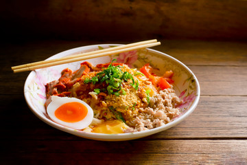 Thai noodles on the old dark wooden table background