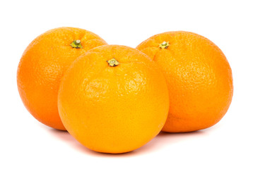 three oranges on a white background