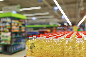 sunflower oil in a red lid stands drawers on a counter in a store