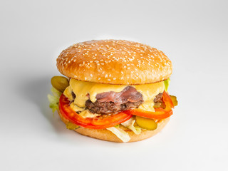 fresh cheeseburger with ham and vegetables